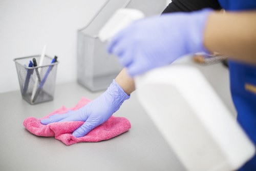 Daily office cleaning in a modern London workspace with desks and shared areas