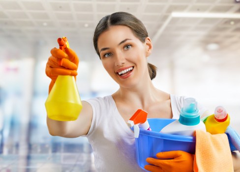 Professional London cleaning service maintaining a tidy living room and surfaces