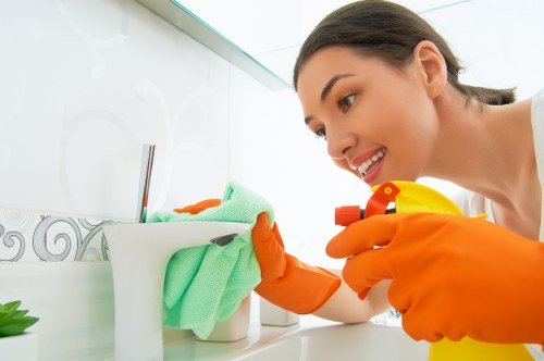 Cleaning professional in London using safe cleaning practices